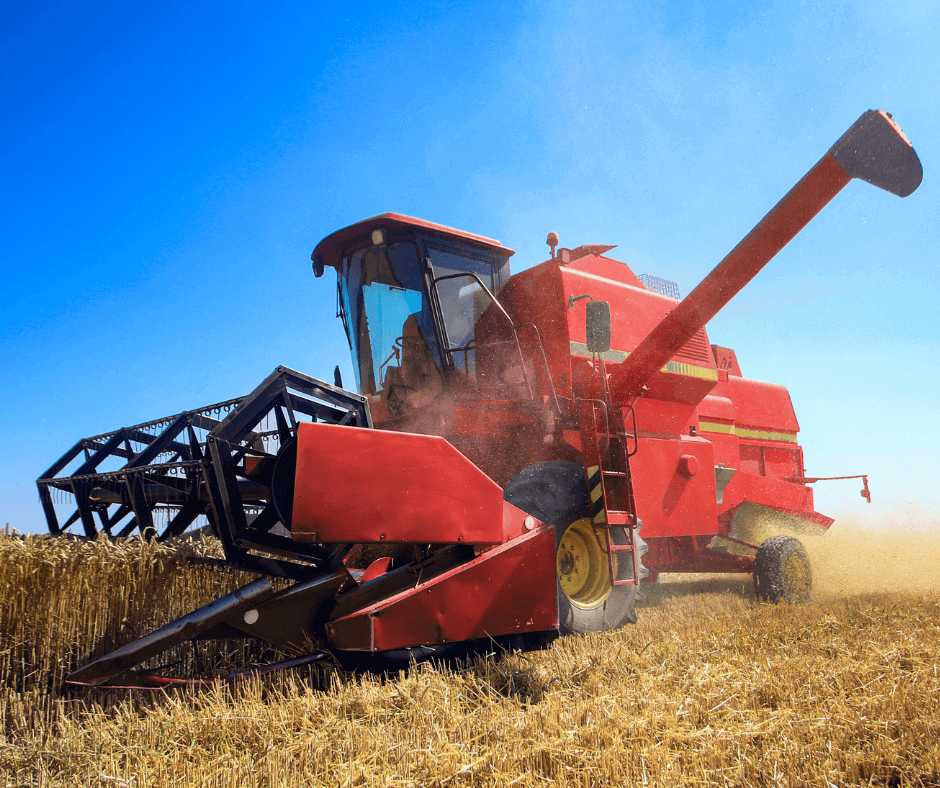 farmer combine in field